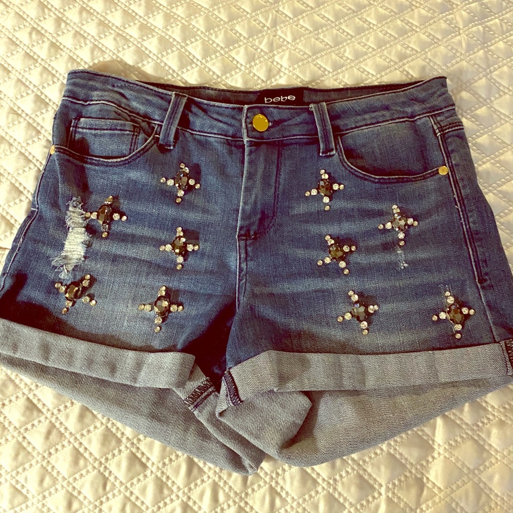 Bebe jean shorts with Jewels on them.